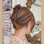 finished hair bun styled with interlocking combs