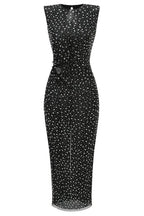 Front view of a black sequined column dress with a cutout waist and button detail