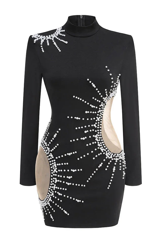 Close-up of the front of a black long-sleeve mini dress with bead embellishments and cutouts.