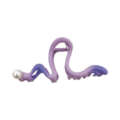 Purple and blue S-shaped hair claw clip with a pearl accent