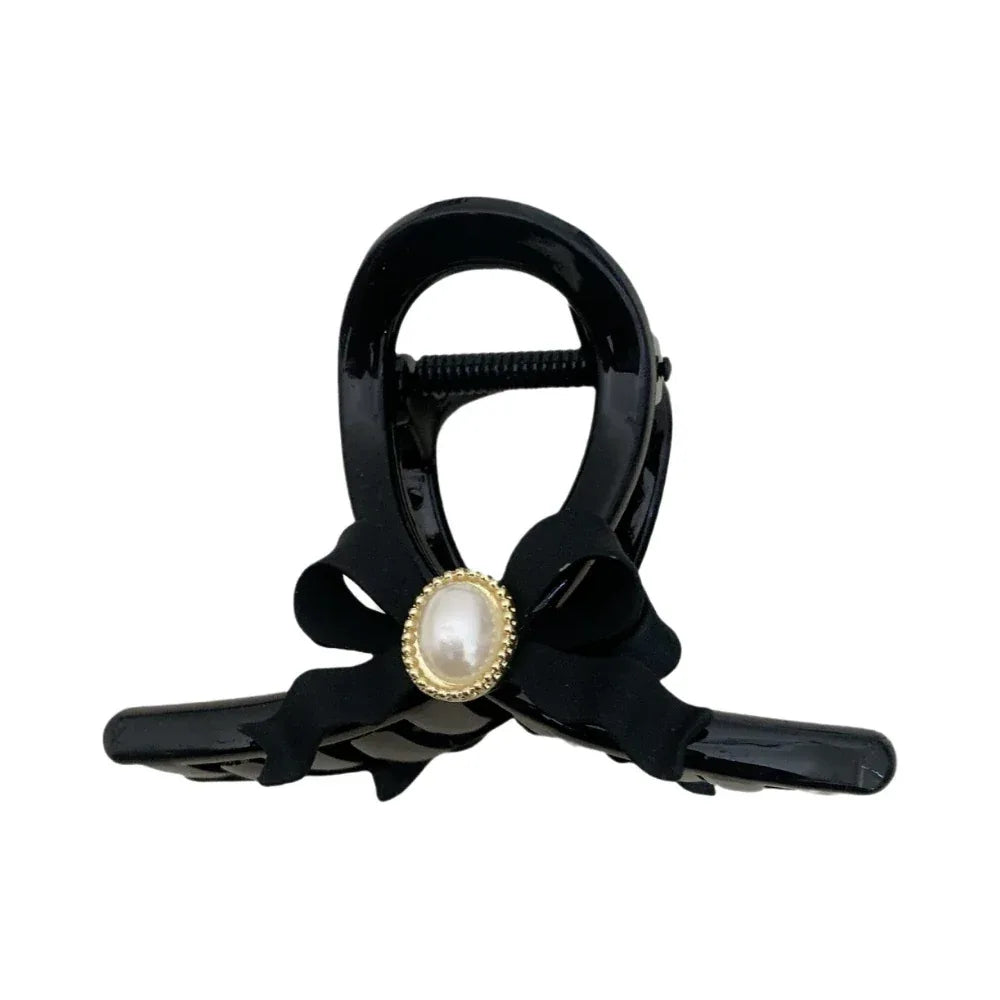 Black hair claw clip with a black velvet bow and pearl accent Main image