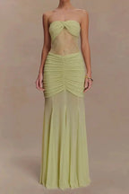 Model wearing a light green strapless gown with lace bodice and ruched skirt