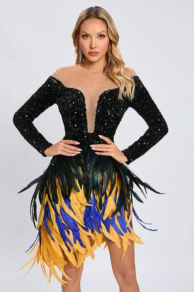 Woman posing in a black sequined dress with a multi-colored feather skirt