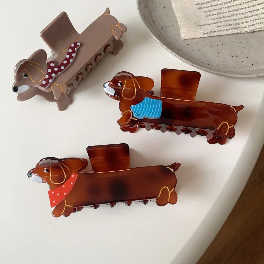 Close-up of dachshund hair claw clips with detailed scarf patterns