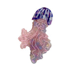 Pink and purple iridescent acrylic jellyfish hair clip with white swirling details and a striped bell.