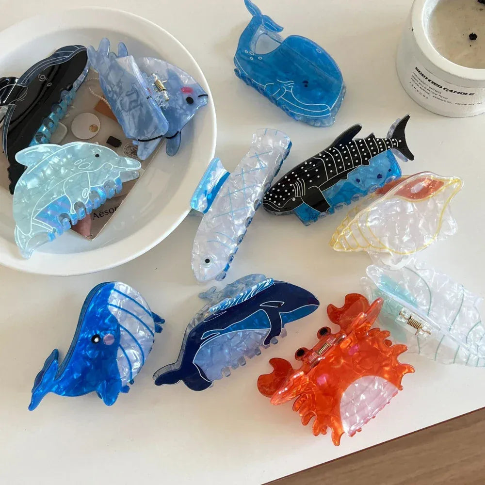 Assortment of marine animal hair clips with various colors and designs