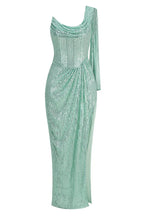 Front view of a mint green sequined column gown with a high slit and draped detail.