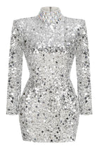 A silver sequined mini dress with a high neckline and long sleeves, displayed as a product shot.