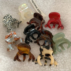 Group of octopus hair claw clips in different designs and hues