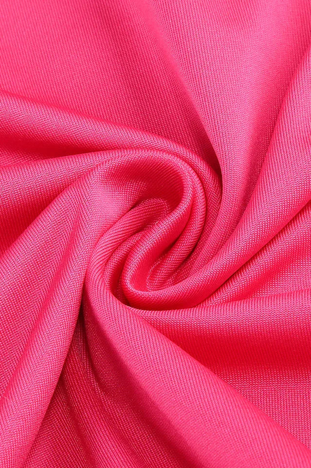 Close-up of the textured hot pink satin fabric.