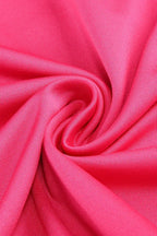 Close-up of the textured hot pink satin fabric.