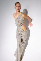 Close-up of a model in a silver sequined draped gown with cut-out details