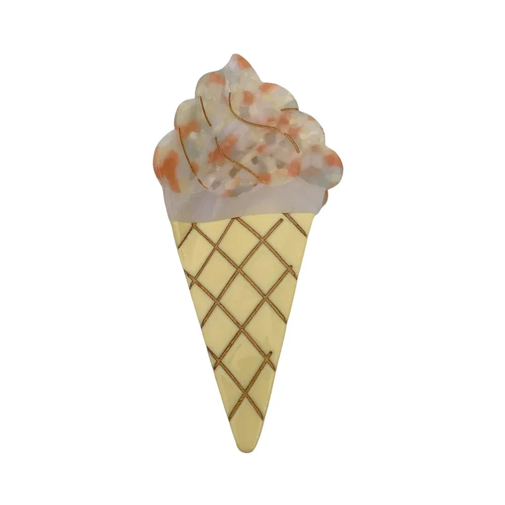 A yellow and orange speckled ice cream cone hair clip.