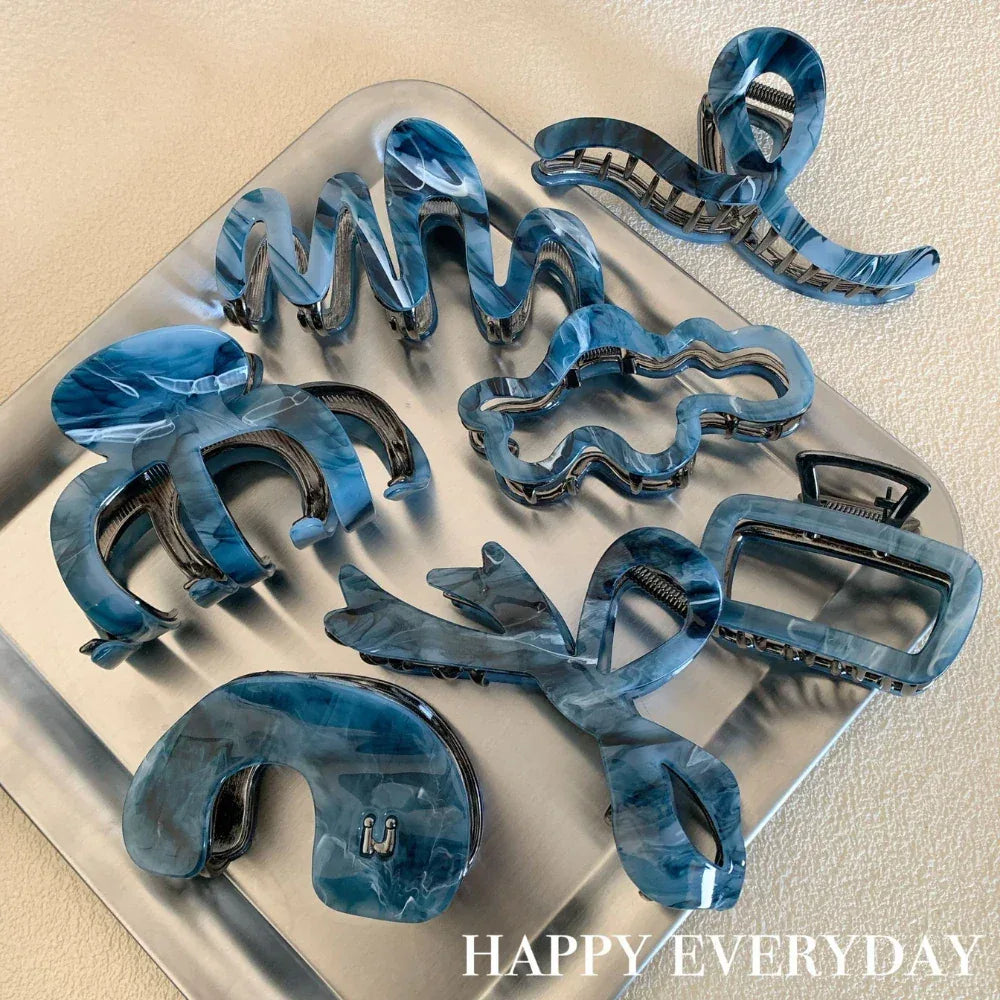 collection of blue marbled hair claws