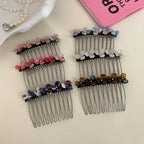 Collection of hair combs featuring floral designs in various color palettes