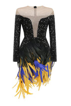 Product shot of a black sequined dress featuring a detailed feather skirt