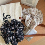 Two floral print chiffon scrunchies on a tote bag