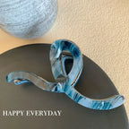 Modern abstract blue and grey marble acetate hair claw clip with a bow silhouette - View 11 | TEVQA