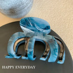 Modern abstract blue and grey marble acetate hair claw clip with a bow silhouette - View 10 | TEVQA