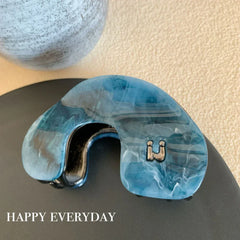 Modern abstract blue and grey marble acetate hair claw clip with a bow silhouette - View 12 | TEVQA