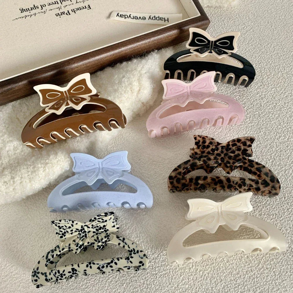 Assortment of bow claw clips in various colors and patterns