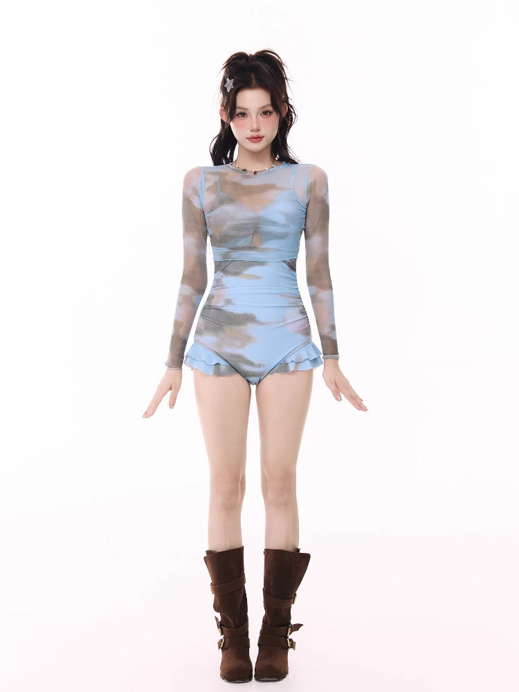 Full body shot of the woman from the front, showcasing the entire swimsuit and boots.