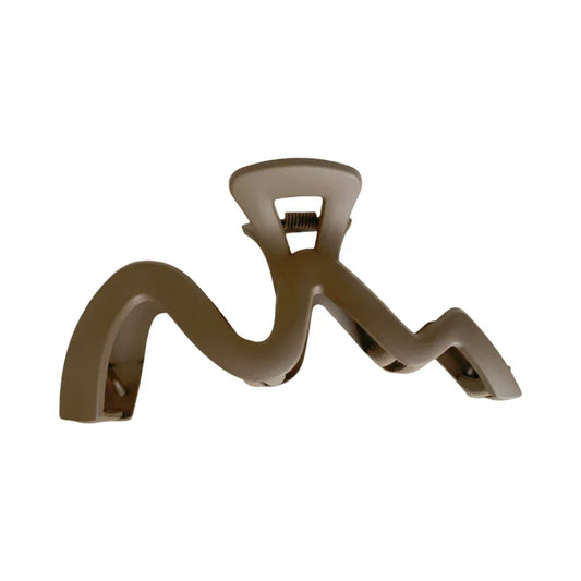 Matte finish wavy claw clip in a neutral beige color.