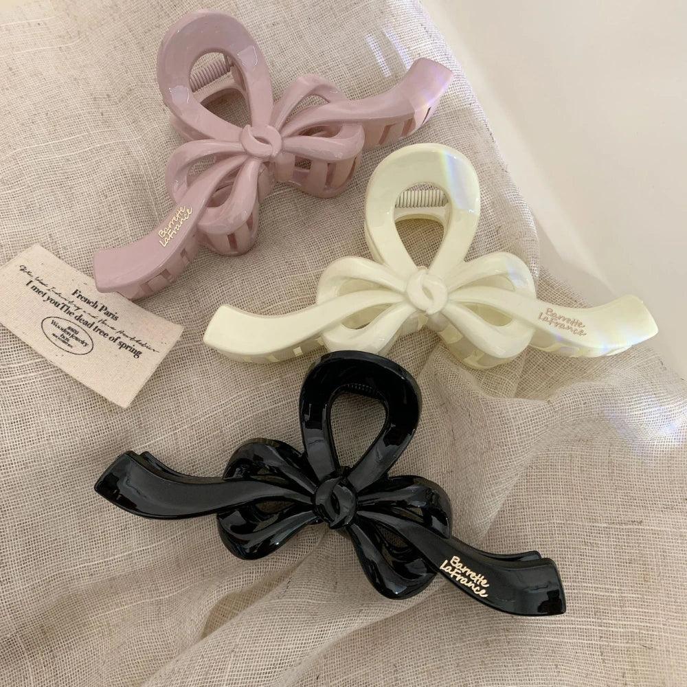 Close-up of bow claw clips in different colors