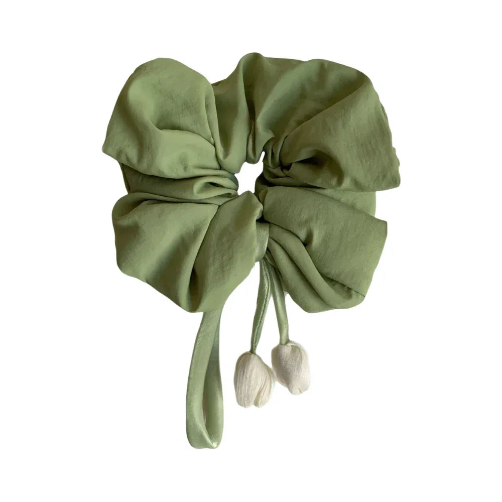 oversized sage green scrunchie with white tulip embellishments