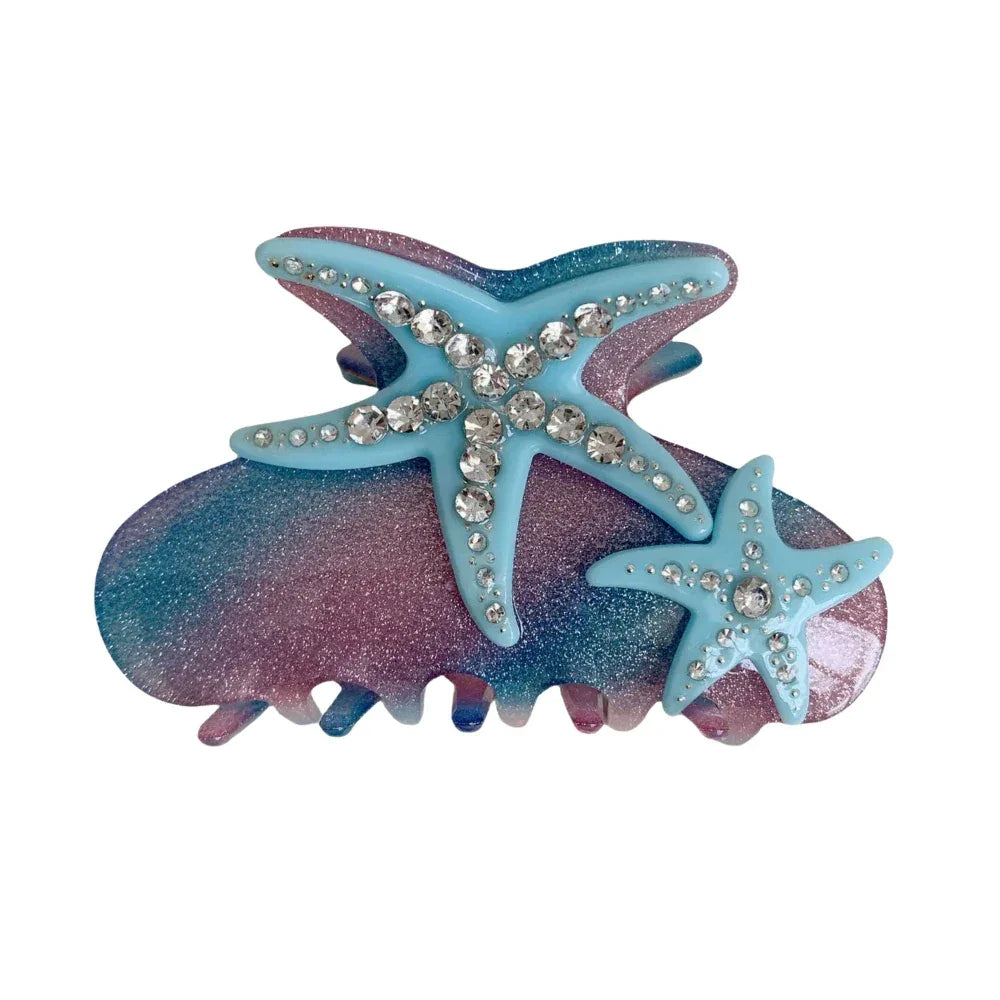 Blue and pink glitter hair claw clip with two starfish embellishments adorned with rhinestones.