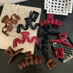 Collection of plaid velvet hair claw clips in various colors and shapes