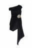 Flat lay of black one-shoulder asymmetrical hem dress with draped detail and rose embellishment