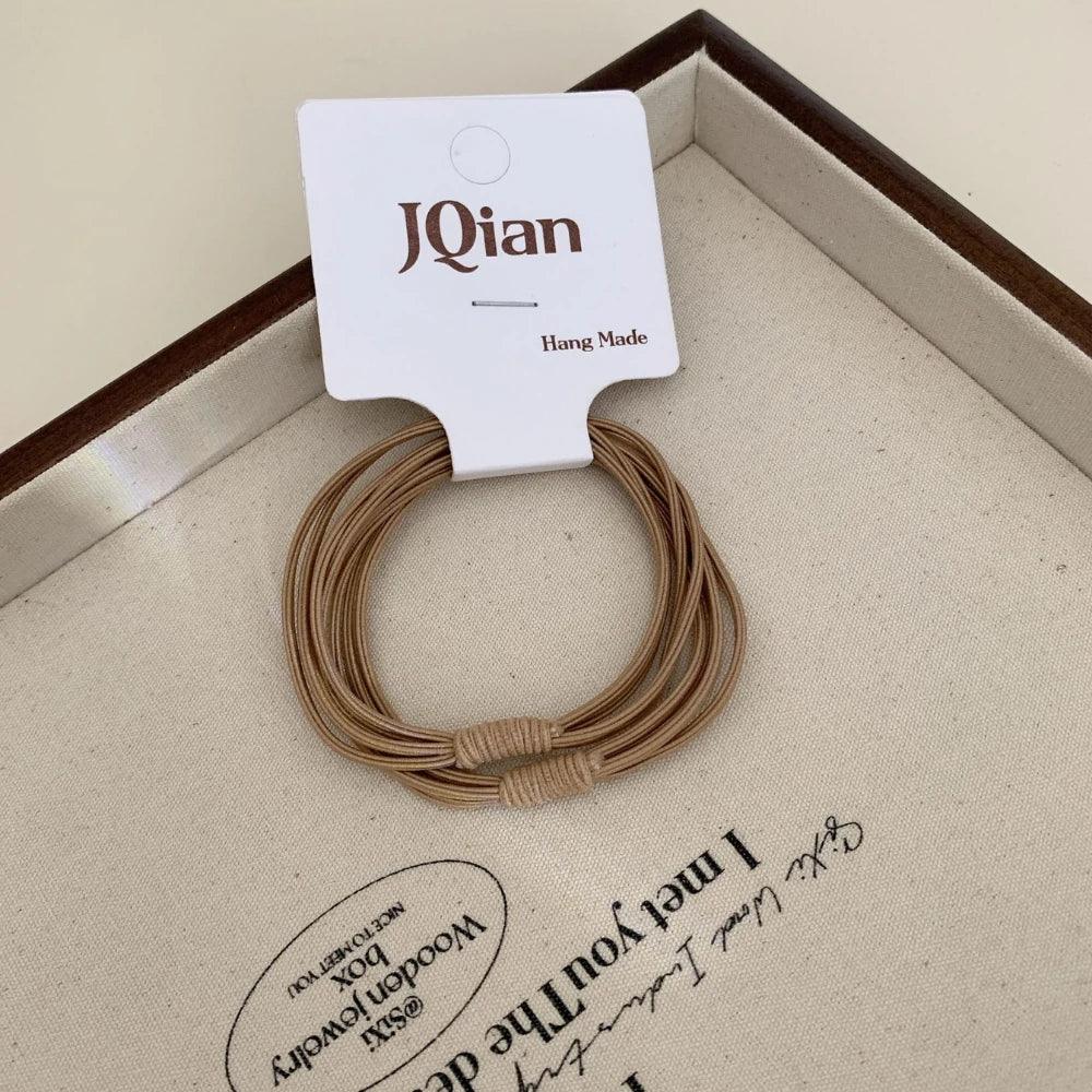 Thin seamless hair elastics in neutral colors - View 6 | TEVQA