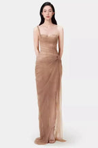 Full-length view of the model in the light blue tulle gown, showcasing the draped skirt and floor-length hem.
