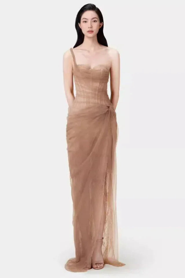 Full-length view of the model in the light blue tulle gown, showcasing the draped skirt and floor-length hem.