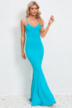 woman posing in a long turquoise mermaid dress
