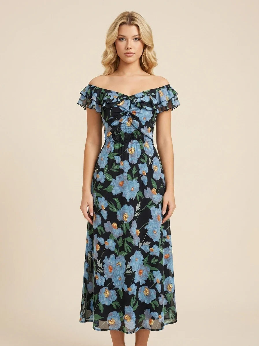 Woman wearing a black off-the-shoulder midi dress with a blue floral print and ruffled short sleeves