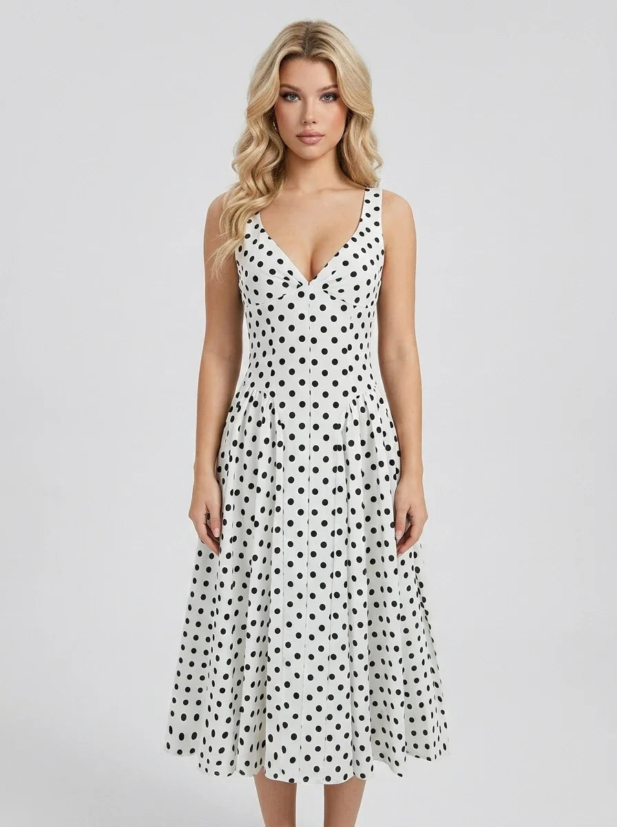 Woman wearing a white polka dot dress