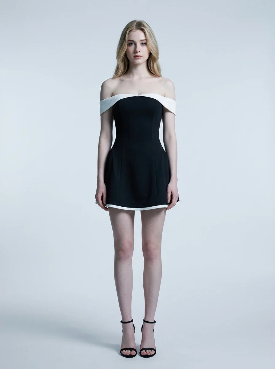 woman in black and white off-the-shoulder dress standing