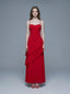 Woman wearing a red floor-length chiffon dress with tiered ruffles and spaghetti straps, front view.