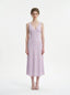 Model wearing a lavender midi dress with a V-neckline and sleeveless design, standing against a white background.