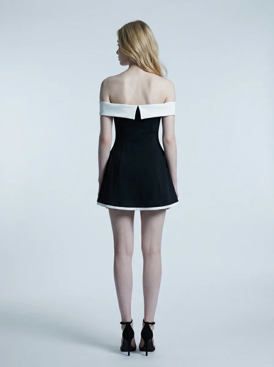 back view of woman in black and white off-the-shoulder dress