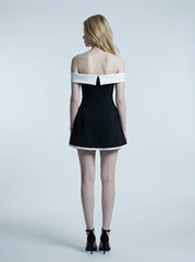back view of woman in black and white off-the-shoulder dress
