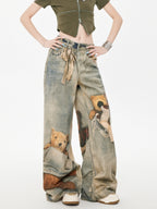 Full body shot of model wearing wide leg jeans with teddy bear graphic print
