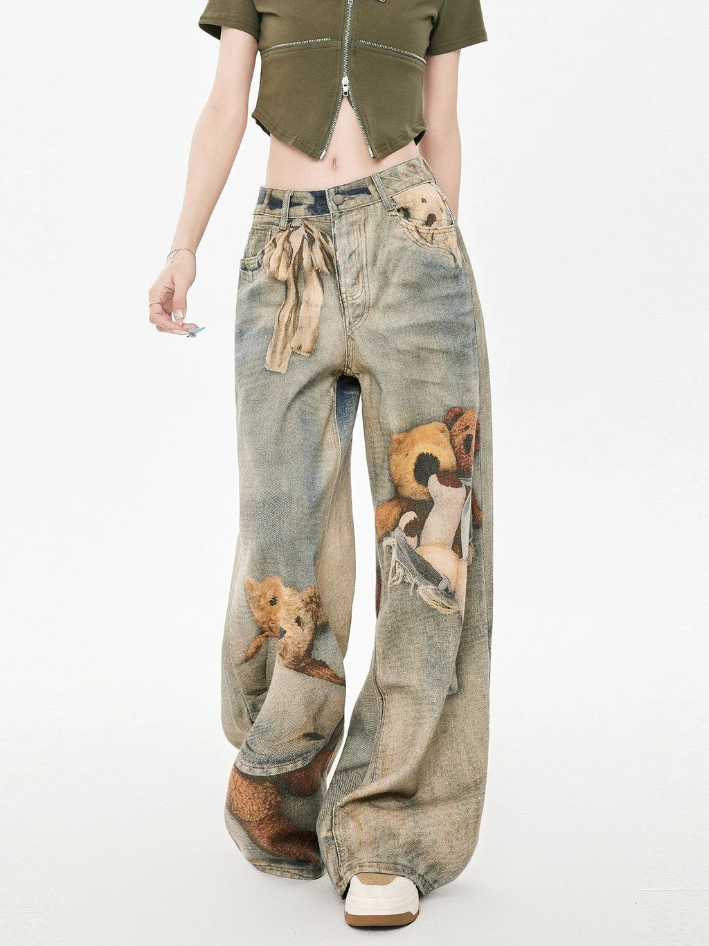 Close-up of the front of wide leg jeans with teddy bear graphic print