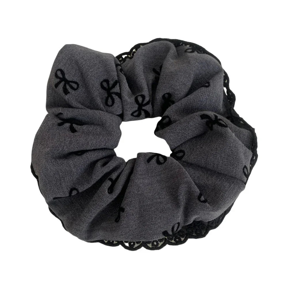 grey scrunchie with black bow pattern and lace trim