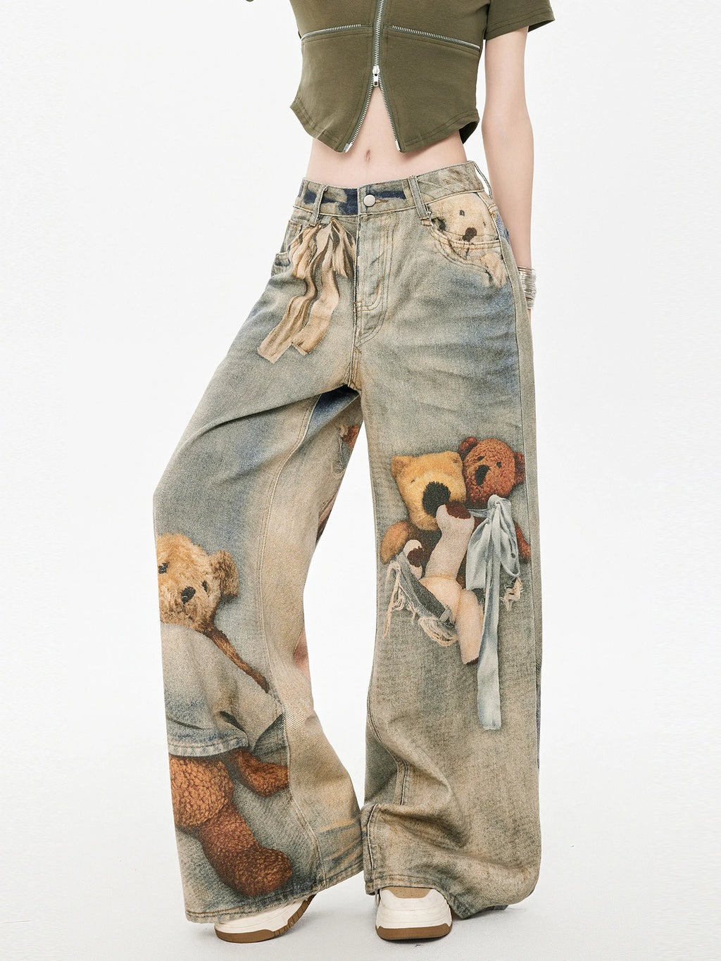 Model posing in wide leg jeans with teddy bear graphic print