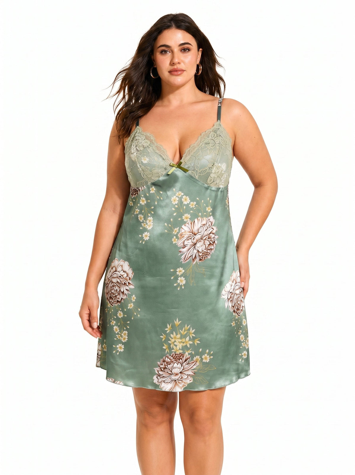 Plus-size model wearing a green satin chemise with a floral print and lace trim