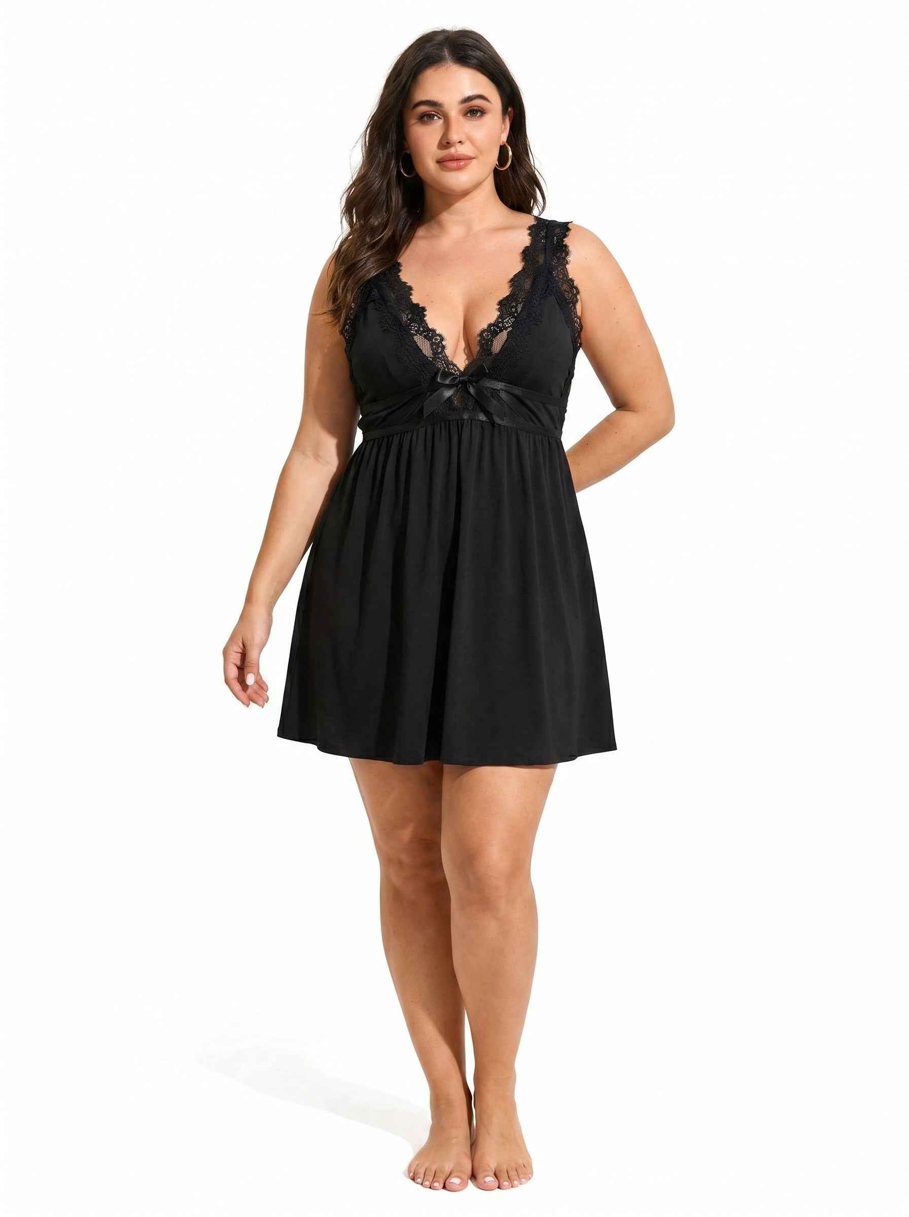 Woman wearing a black lace-trimmed babydoll nightgown from the front