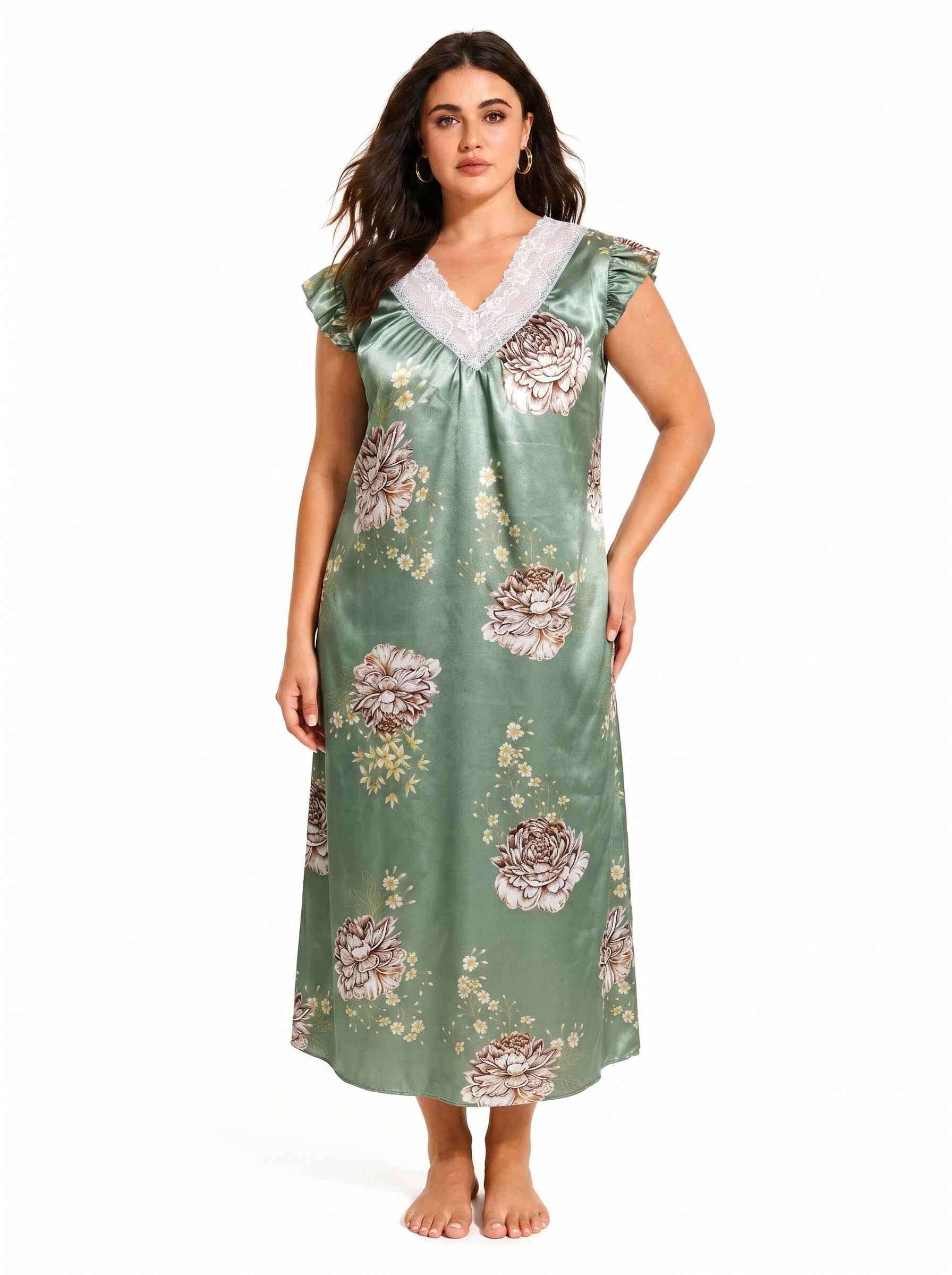 Woman wearing a green floral satin nightgown with lace trim